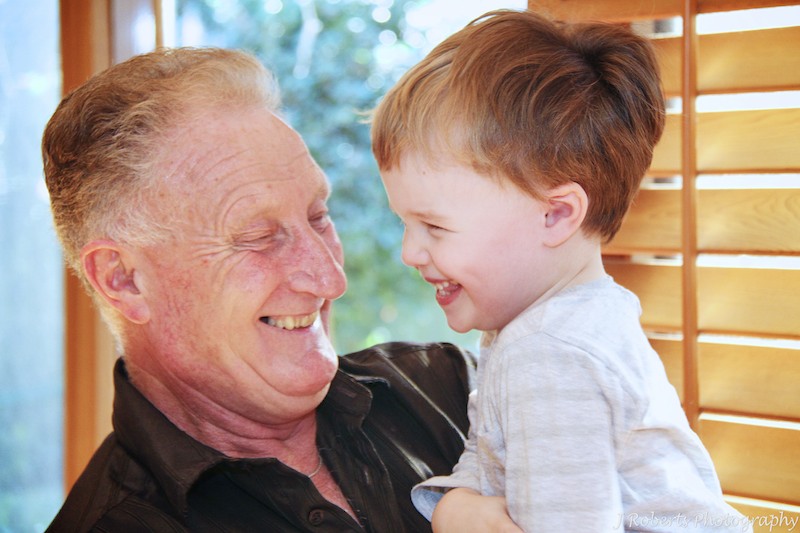 Grandad and grandson laughing together - family portrait photography sydney